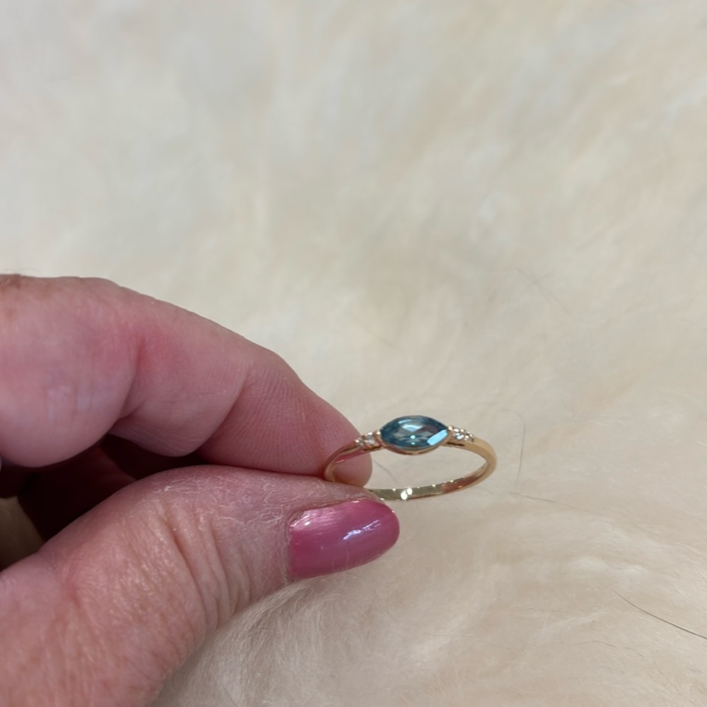 London blue topaz with accent diamonds. 14k yellow gold. Size 8.